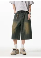 Bermuda de jean color gris oscuro con efecto desgastado, corte ancho, largo a la rodilla y cintura elástica.