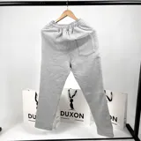 Pantalón de jogging gris melange de algodón, corte recto y cintura con cordón ajustable.