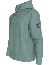 Buzo con capucha Calvin Klein color verde agua, de corte regular, con cordones ajustables, puños y bajo con punto canalé, bolsillo canguro e insignia con el logo de Calvin Klein en la manga.