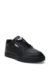 Championes deportivos Puma modelo Caven III, color negro con detalles en plateado y suela de goma negra.