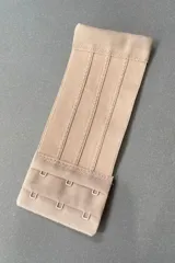 Extensor de contorno de soutien negro con tres ganchos, 15 cm de largo por 6 cm de ancho.