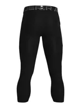 Calza de compresión deportiva Under Armour modelo HeatGear, de largo 3/4, color negro. Presenta cintura elástica ancha con logo de la marca y bolsillo lateral Strength Pocket.