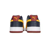 Championes Puma RBD Game Low, color azul marino con detalles en blanco, amarillo y rojo.