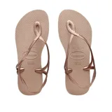 Ojotas Havaianas modelo Luna, color rosa nude, con tira fina trasera y diseño trenzado en la tira delantera.