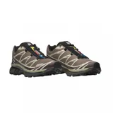 Championes de trail running Salomon modelo XT-6, color marrón con detalles en negro y blanco. Presentan un diseño técnico con sistema de cordones rápidos, refuerzos laterales y suela de alta tracción.