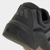 Championes de entrenamiento Adidas Dropset 4, color negro con detalles en gris oscuro y suela de goma en tono marrón. Diseñados para estabilidad en levantamiento de pesas y movimientos explosivos, cuentan con empeine de malla resistente y tecnología de retorno de energía.