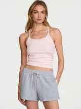 Pantalones cortos deportivos de felpa gris jaspeado medio, de tiro medio y ajuste relajado, con cintura elástica y cordón ajustable, bolsillos laterales ribeteados y tejido French Terry.