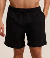 Bermuda deportiva Get Over de color beige, con cintura elástica, cordón ajustable contrastante, bolsillo trasero y pequeña estampa localizada.
