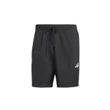 Shorts deportivos Adidas Essentials Small Logo Chelsea, color negro con logo blanco en la pierna izquierda, cintura elástica con cordón ajustable y corte clásico.