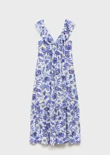 Vestido largo de corte evasé con estampado floral en tonos azules sobre fondo blanco. Presenta cuello de pico, tirantes con volantes y cierre de cremallera lateral.