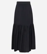 Pollera midi de algodón con diseño acampanado y cierre lateral. Presenta un estampado contrastante de palmeras y motivos arabescos sobre fondo oscuro.