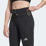 Calza deportiva larga de running Adidas, color negro, con ajuste ceñido, cintura alta con cordón de ajuste y bolsillos laterales en los muslos. Cuenta con tecnología CLIMACOOL y logo reflectivo.