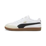 Championes Puma 9-T de estilo urbano, con capellada blanca de cuero sintético, franja lateral negra, puntera de gamuza en tono beige y suela de goma color caramelo.