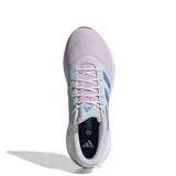 Championes Adidas Response Runner para mujer, con diseño en malla color violeta lavanda, detalles en verde agua y las icónicas tres tiras de la marca en azul. Cuenta con una entresuela blanca amortiguada y suela negra.
