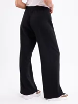 Pantalon de felpa negro de corte recto y holgado, con cintura elástica y cordón ajustable.