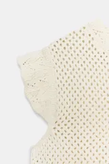 Top de cuello redondo y mangas sisa con volantes, confeccionado en tejido de punto calado con algodón y bajo con detalle de volantes.
