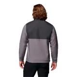 Campera cortaviento Columbia modelo Ascender, confeccionada en tejido softshell con tecnología Omni-Shield repelente al agua. Presenta diseño bicolor en tonos gris y grafito, cuello alto con protector de mentón, cierre frontal completo, bolsillos laterales y en el pecho con cremallera, y puños ajustables.
