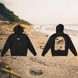 Hoodie negro oversize con capucha y estampado de palmeras y sol en la espalda.