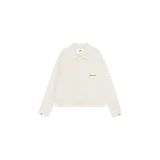 Camisa de manga larga de Eme Studios con diseño a cuadros finos sobre fondo color arena, corte recto, cierre frontal de botones y bolsillo en el pecho con logo bordado.