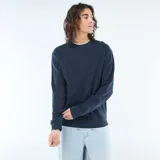 Sweater de punto con textura nido de abeja, color azul marino, cuello redondo y mangas largas con puños elásticos.