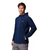 Campera técnica Columbia con capucha ajustable, confeccionada en tejido softshell azul marino con tecnología Omni-Shield. Presenta cierre frontal y bolsillo en el pecho con detalles en azul vibrante, además de bolsillos laterales con cierre y puños elásticos.