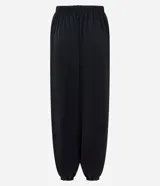 Pantalón modelo aladino de corte holgado, confeccionado en crepé negro. Presenta cintura elástica y puños elásticos en el bajo, con un diseño de volumen tipo globo.