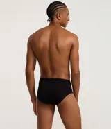 Calzoncillo slip de poliamida color negro, con cintura elástica y logo "Mash" impreso en el frente.