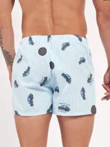 Bóxer de algodón blanco con estampado de flores pequeñas color celeste, con cintura elástica y logo de la marca en el centro.