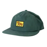 Gorra verde con visera curva y parche frontal amarillo con el logo "TCSS" en naranja y una palmera, y el texto "CRITICAL SLIDE X LA ISLA".