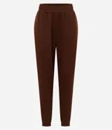 Pantalón jogger de corte holgado confeccionado en tejido fleece color beige, con cintura elástica y puños ajustados en el bajo. Cuenta con bolsillos laterales.