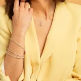 Pulsera semirrígida de plata 925, compuesta por una cadena fina con pequeñas esferas intercaladas a lo largo de toda la pieza.