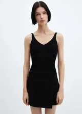 Top sin mangas de tejido de punto acanalado, con escote en pico tanto en el frente como en la espalda y diseño entallado al cuerpo.