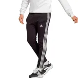 Pantalón de jogging Adidas Essentials Single Jersey negro con tres rayas blancas a los costados y logo de la marca bordado en blanco.