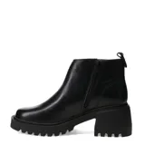 Bota de caña baja marca Bottero, confeccionada en cuero negro con acabado brillante. Presenta cierre lateral, puntera redondeada y suela track robusta con taco cuadrado.