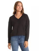 Buzo de modal con escote en V, de manga larga y corte holgado. Presenta puños y ruedo con terminación acanalada.