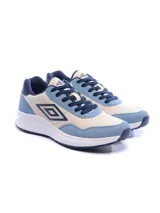Championes Umbro modelo Volcan, con diseño urbano en combinación de colores beige y azul. Presentan el logo de la marca en el lateral, suela blanca de plataforma y cierre con cordones.