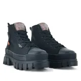 Botas de caña alta Palladium Revolt, color negro, con suela de plataforma gruesa y cordones. Presentan logo de la marca en el lateral y etiqueta con el año 1947 en la caña.