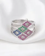 Anillo múltiple compuesto por cinco bandas finas de plata 925, unidas en un diseño que presenta incrustaciones de circonias en tonos azul, verde, rosa y blanco.