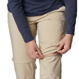 Pantalón convertible de senderismo color beige, con perneras desmontables mediante cremallera que permiten transformarlo en shorts. Cuenta con bolsillos laterales y traseros, diseñado con tecnología de protección solar.