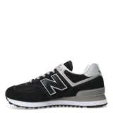 Championes New Balance 574, color negro con detalles en gris y blanco, confeccionados en gamuza y malla, con logo "N" característico en los laterales y entresuela ENCAP.