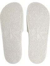 Ojotas tipo slide blancas, con tira ancha de lona que presenta el logo 'CK' en relieve y la inscripción 'CALVIN KLEIN JEANS' grabada en la plantilla ergonómica.