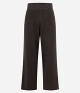 Pantalón de corte recto confeccionado en tejido de punto, con cintura elástica de tiro medio. Presenta un diseño minimalista y cómodo, ideal para un look sofisticado.