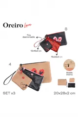 Set de tres necessaires de diferentes tamaños, confeccionados en materiales sintéticos. Incluye un necessaire grande de color marrón con estampado de labios rojos, un mediano negro con acabado brillante y uno pequeño marrón claro con la inscripción 'Oreiro Love' y tira de muñeca.