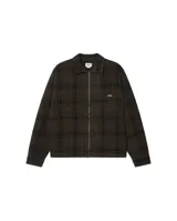 Campera tipo camisa de la marca Obey, con cierre frontal completo, cuello clásico y bolsillos frontales. Presenta un diseño a cuadros en tonos oscuros y el logo de la marca bordado en el pecho.