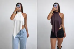 Top de satén color marrón con escote halter y diseño asimétrico en punta. Posee espalda descubierta y cierre con lazo fino en el cuello.