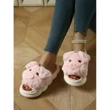 Pantuflas de peluche gris con diseño de chanchito, con suela de goma blanca y modelo abierto sin talón.