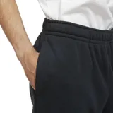 Pantalón de jogging Nike Sportswear Club Fleece, color azul marino, con cintura elástica, puños acanalados en los tobillos y logo de la marca bordado en blanco en la pierna izquierda.