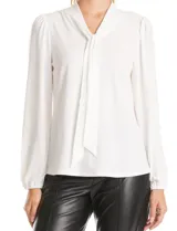 Blusa de seda fría color negro, con escote en V y lazo decorativo al cuello. Presenta mangas largas abullonadas con puños elásticos y detalles de strass aplicados en cuello, lazo y mangas.