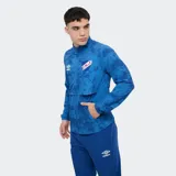 Campera deportiva Umbro del Club Nacional de Football, modelo Grok de color azul con estampado abstracto, cuello alto, cierre frontal completo y bolsillos laterales.