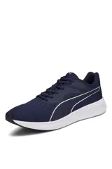 Championes deportivos Puma Transport de color azul marino, con suela blanca y el característico logotipo de la franja en color blanco en los laterales.